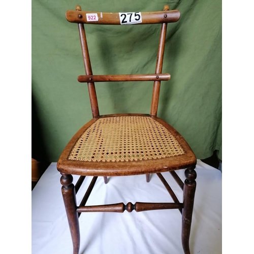 275 - An Edwardian country chair with cane seat and horizontal stick bar back design