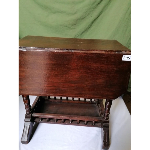 305 - A small Edwardian dropleaf table with balustraded lower tier on bracket feet; ht 59cm
