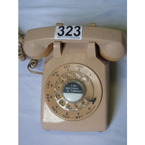 323 - A retro flesh pink round dial telephone