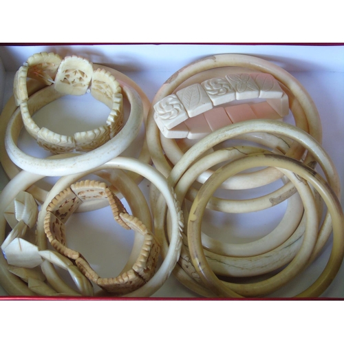 330 - Collection of white bone bangles in a box