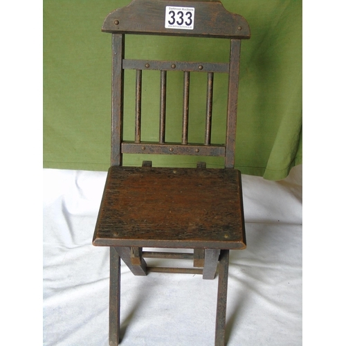 333 - An antique child's wooden folding chair
