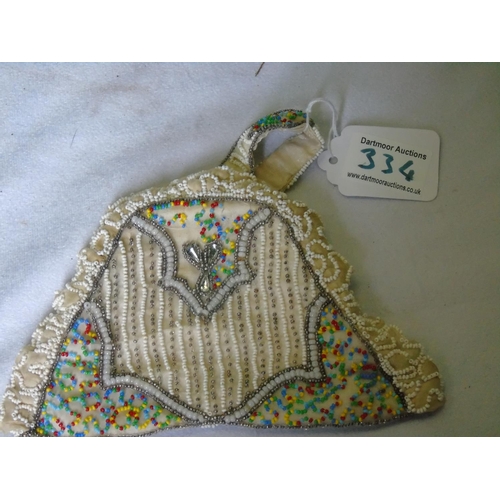 334 - A vintage beaded silk lined purse