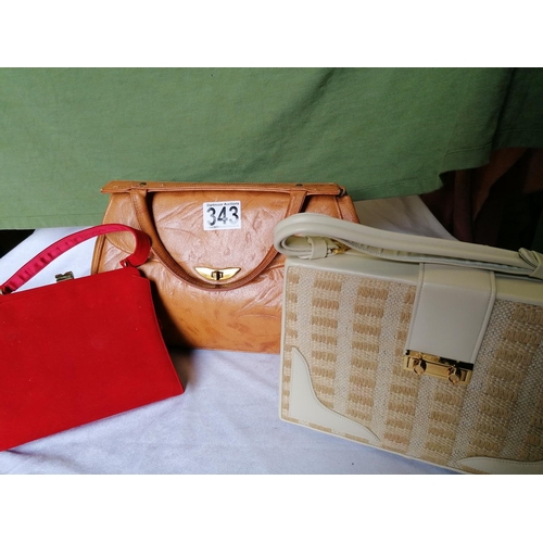 343 - Three vintage handbags