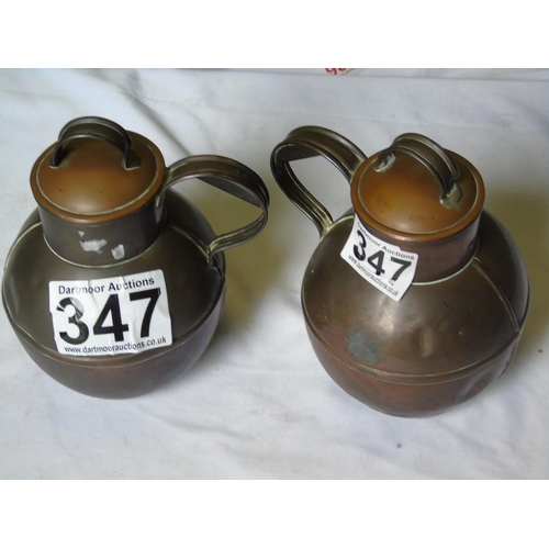347 - Two copper Guernsey jugs, height 21cm