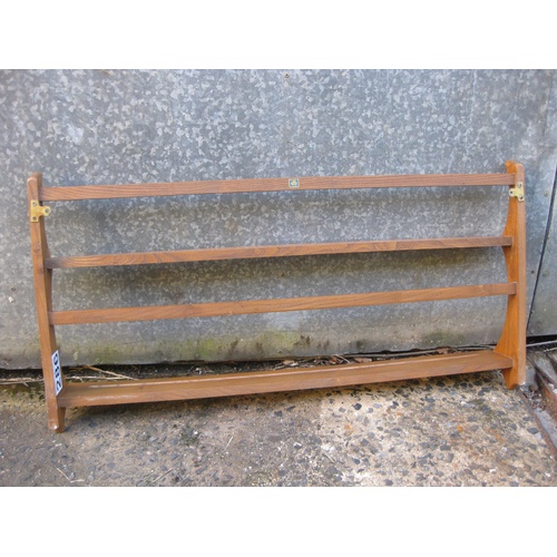 286 - An Ercol (stamped) mid century light wood plate rack with original wall fixings, elegant stag's horn... 