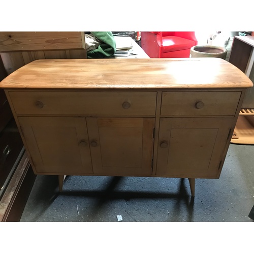 282 - A mid century Ercol Windsor blonde wood beech and elm sideboard in excellent condition, with cutlery... 