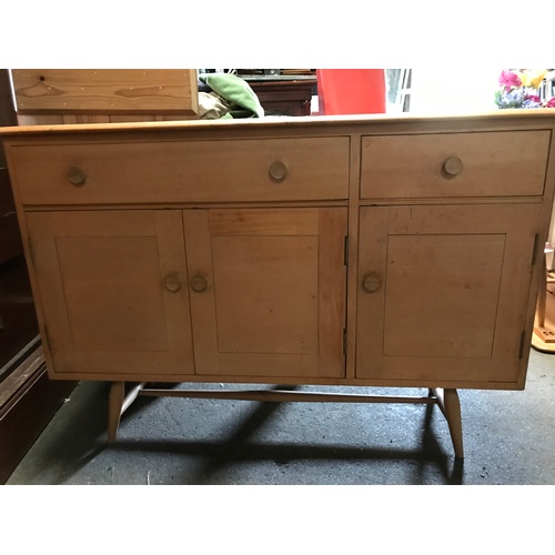 282 - A mid century Ercol Windsor blonde wood beech and elm sideboard in excellent condition, with cutlery... 