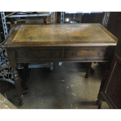 273 - Early 20C mahogany flat top writing table with leather top and two drawers, turned legs. H73 L90 D53... 