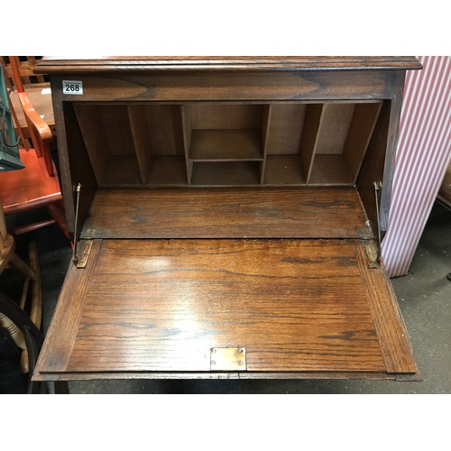 268 - An early 20C oak fall front student's desk with stationery compartments as photographed, f/w drawer ... 
