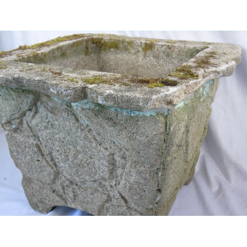 1 - A weathered cast concrete planter