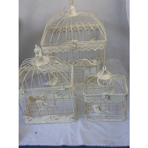 3 - A graduated set of three bird cages