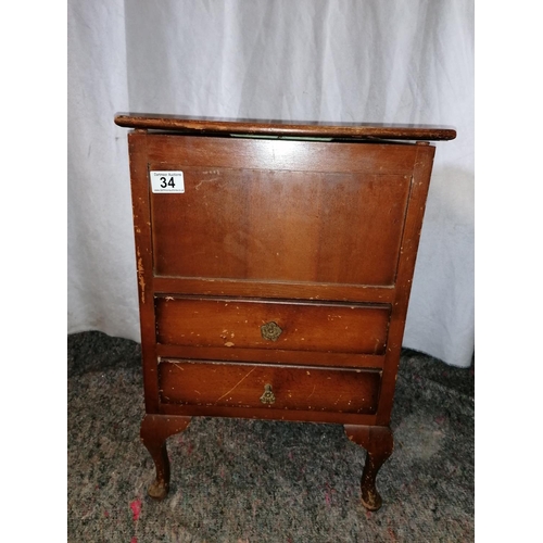 34 - Early 20C sewing cabinet on cabriole legs with lift up lid, two drawers, green silk linings