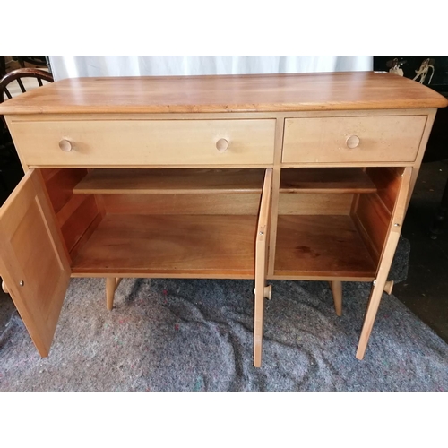 41 - A mid century Ercol Windsor blonde wood beech and elm sideboard in excellent condition, with cutlery... 