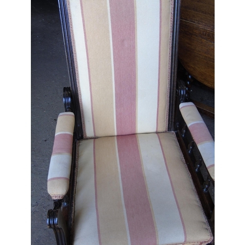 53 - A nursing chair with adjustable back and balustraded arms