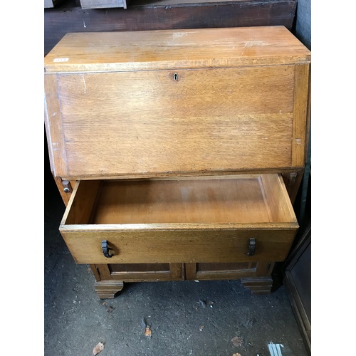 57 - An early 20C light oak fall front bureau with stationery compartments and working key H103 W76 D44 c... 