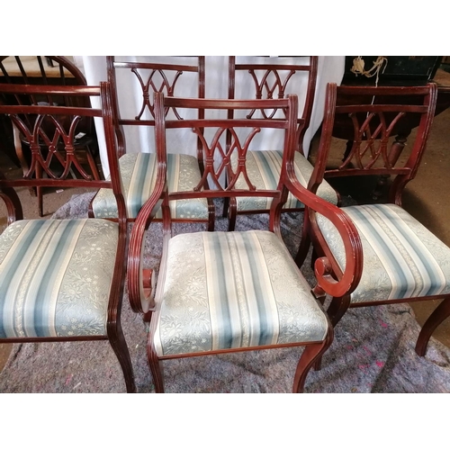 63 - A set of five reproduction dining chairs, including one carver with scroll arms, fretwork seat backs... 