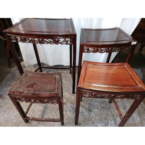 65 - A nest of four tables in Oriental style with latticework fruit pattern side returns, dark wood, max ... 