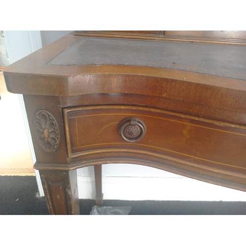 79 - A bow fronted lady's writing table with moulding and stringing: H96 (to desktop) W92 needing some re... 