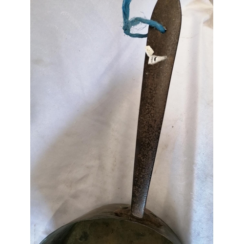 82 - A large antique copper saucepan with an iron handle, likely French, diameter 31cm