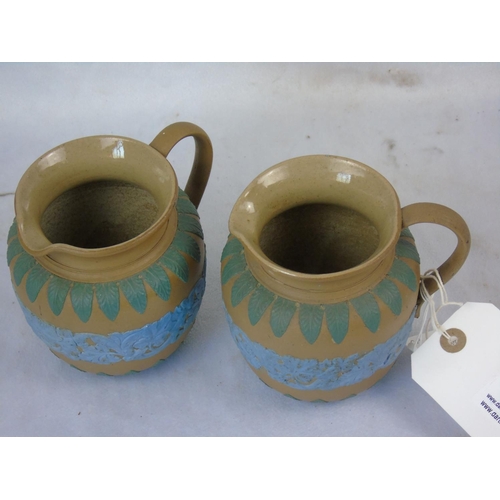 98 - A pair of Doulton Lambeth jugs in good condition