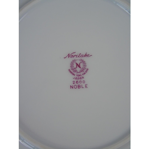 106 - A large quantity of Noritake porcelain dinnerware, 21 piece setting, with zip storage bags