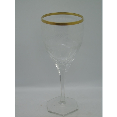 109 - Seven wine glasses with with gold rim and banding, hexagonal bases and four champagne glasses with g... 