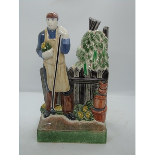 122 - Two RYE studio pottery figurines, 2000 and 2001 - man with carthorse and gardener with hoe, base mar... 