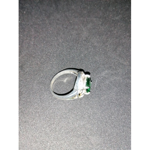 168 - A silver ring with greenstone