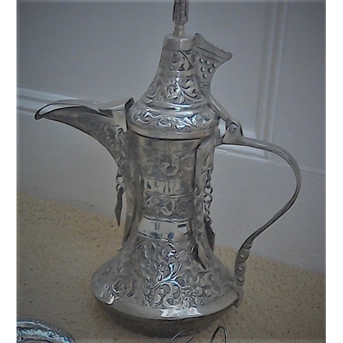 176 - A vintage Omani silver (low silver) Dallah coffee pot