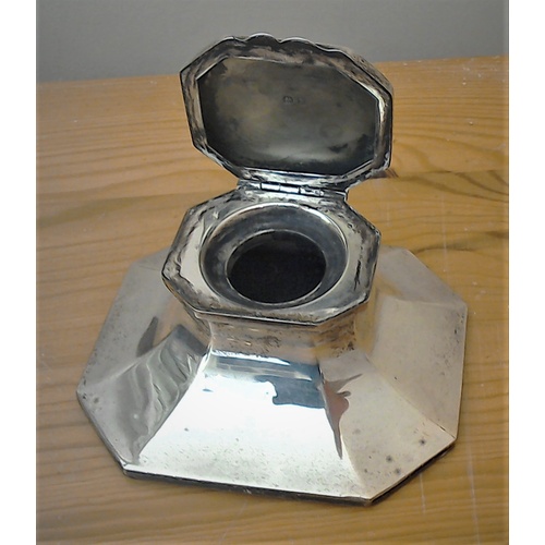 185 - Two Sterling silver items: A Sterling silver inkwell of capstan style,  hall marked, and a 1920s sil... 