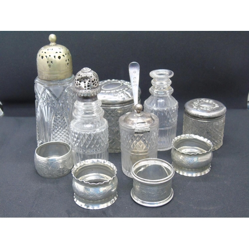 188 - A mixed lot of silver and plated ware: an antique condiments holder with three glass containers, one... 