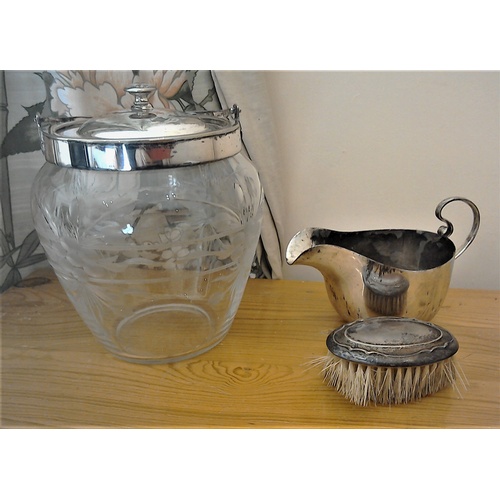 190 - Miscellaneous silver and plated items: an etched glass biscuit barrel,  a gravy jug, a candlestick w... 