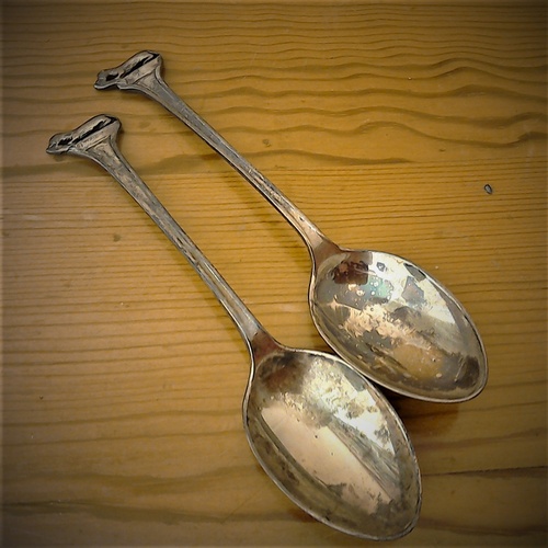 192 - Two delightful antique Sterling silver otter teaspoons,  hallmarked