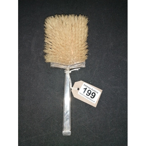 199 - An Art Deco period silver backed hair brush