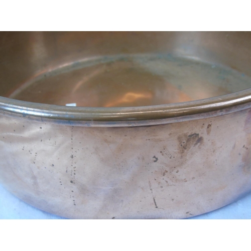 212 - A real Victorian copper heavy preserving pan with brass handles measuring 16