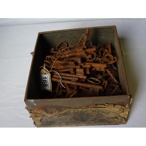 231 - A tin box of old iron keys