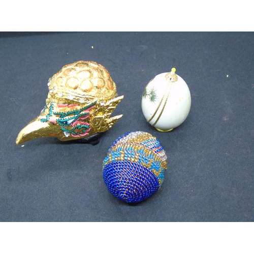 248 - Two decorative eggs -one beaded, one with gold trim and bird; a gilded Asian bird's head ornament wi... 