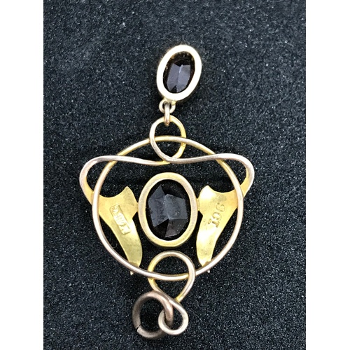 249 - A very pretty Edwardian Art Nouveau 9 carat (marked) gold pendant with two red gemstones, possibly g... 