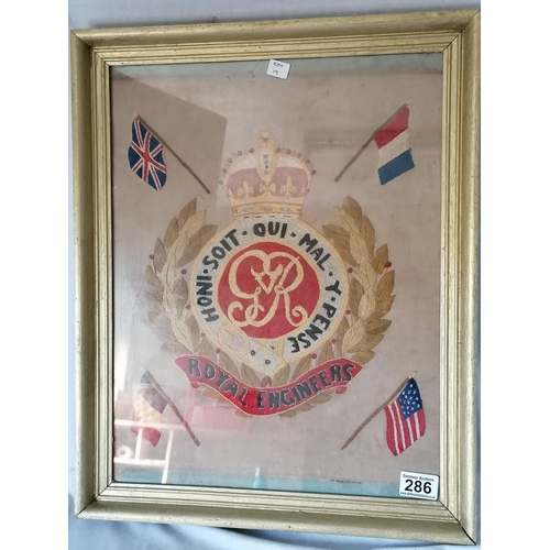 286 - An old framed tapestry of the Royal Engineers crest