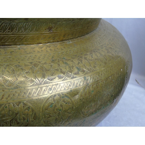 331 - A large Middle Eastern (probably Persian) brassed vessel engraved and hammered with fine Arabic Isla... 