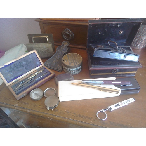 337 - A miscellany of vintage items including a small metal trunk, cash/deeds tin, a letter rack, a compas... 