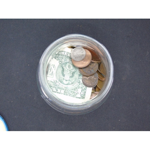 369 - A collection of 20C coins in a jar and a dollar bill