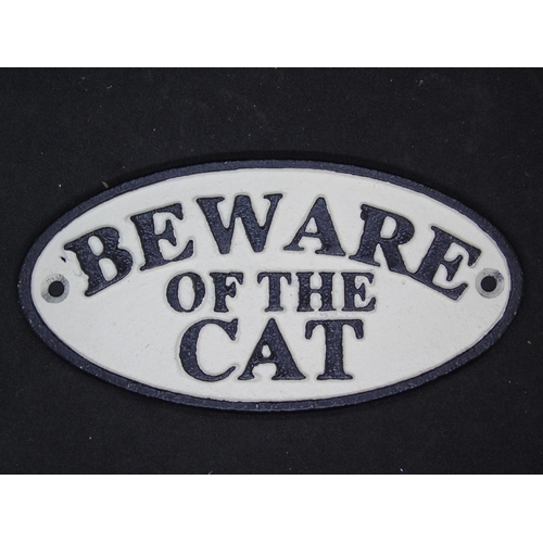 582 - A cast iron 'Beware of the cat' sign