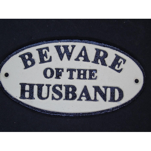 584 - An iron 'Beware of the husband' sign