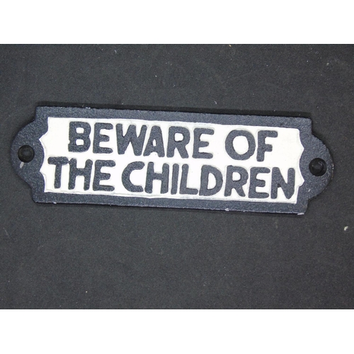 585 - An iron 'Beware of the children' sign