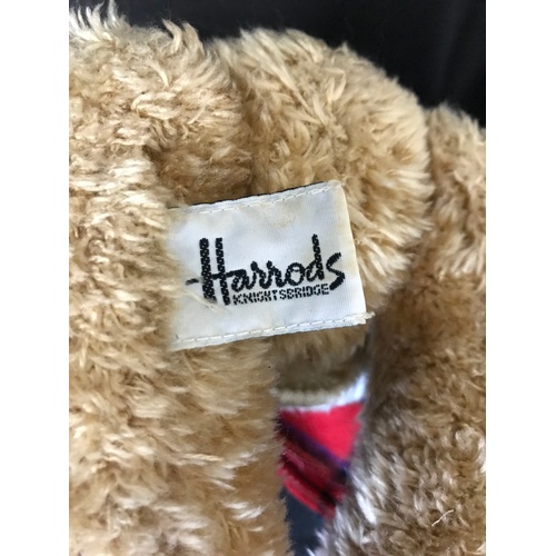 238 - A Burberry gentleman's tie and four SW1 teddy bears from Harrods and Hamleys