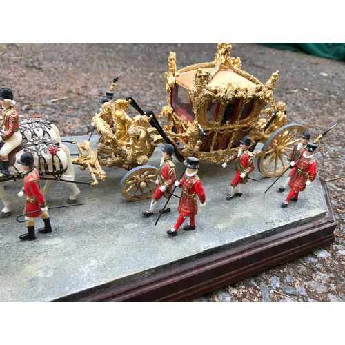 263 - Three Royal memorabilia models; a superb Enesco Ray Ayres Border Fine Arts 24k Gold State Coach from... 