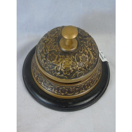 577 - A brass reception bell with wooden base