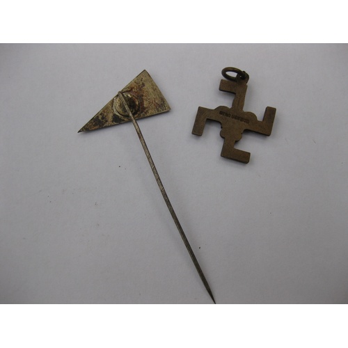 348 - A swastika-shaped metal pendant with plume of feathers in centre and a registration number stamped o... 