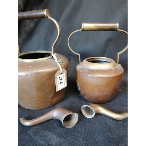 202 - Two copper and brass kettles - spouts detached